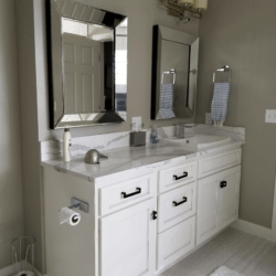 Custom white cabinets with bathroom from right