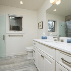 Custom white cabinets with bathroom downstairs