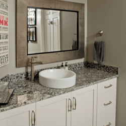 white and gold cabinets in a bathroom 