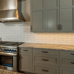 Grey Cabinets with white backsplash closeup