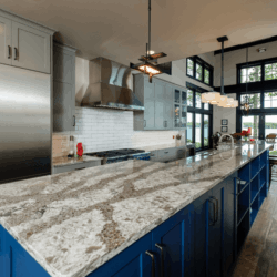 grey white and blue cabinets in a kitchen 